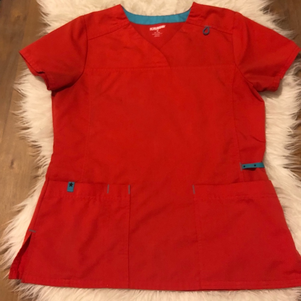 Bright orange scrub top